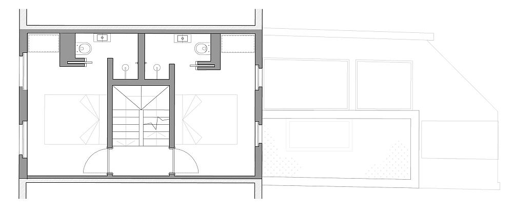 Al doilea nivel, cu două dormitoare dispuse de o parte și alta a scării interioare.
